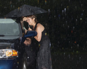 woman locked out of car in rain